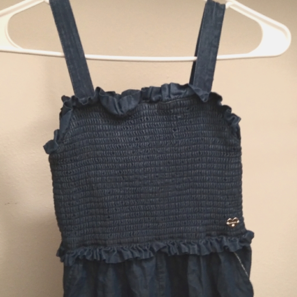 Blue jumpsuit with side pockets